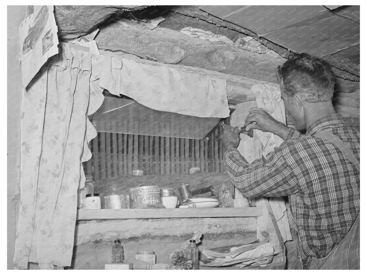 Jack Whinery Repairs Window in Dugout June 1940