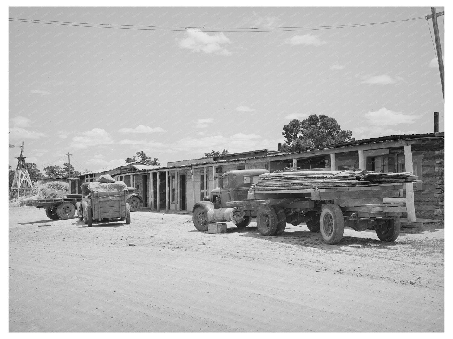 Trucks at Sawmill Cabins in Pie Town New Mexico 1940