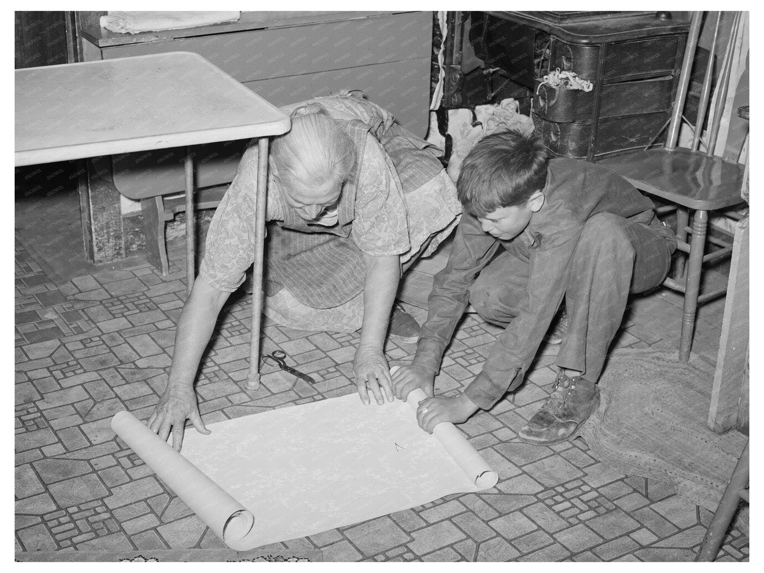 Mrs. Hutton and Grandson Wallpapering Kitchen 1940