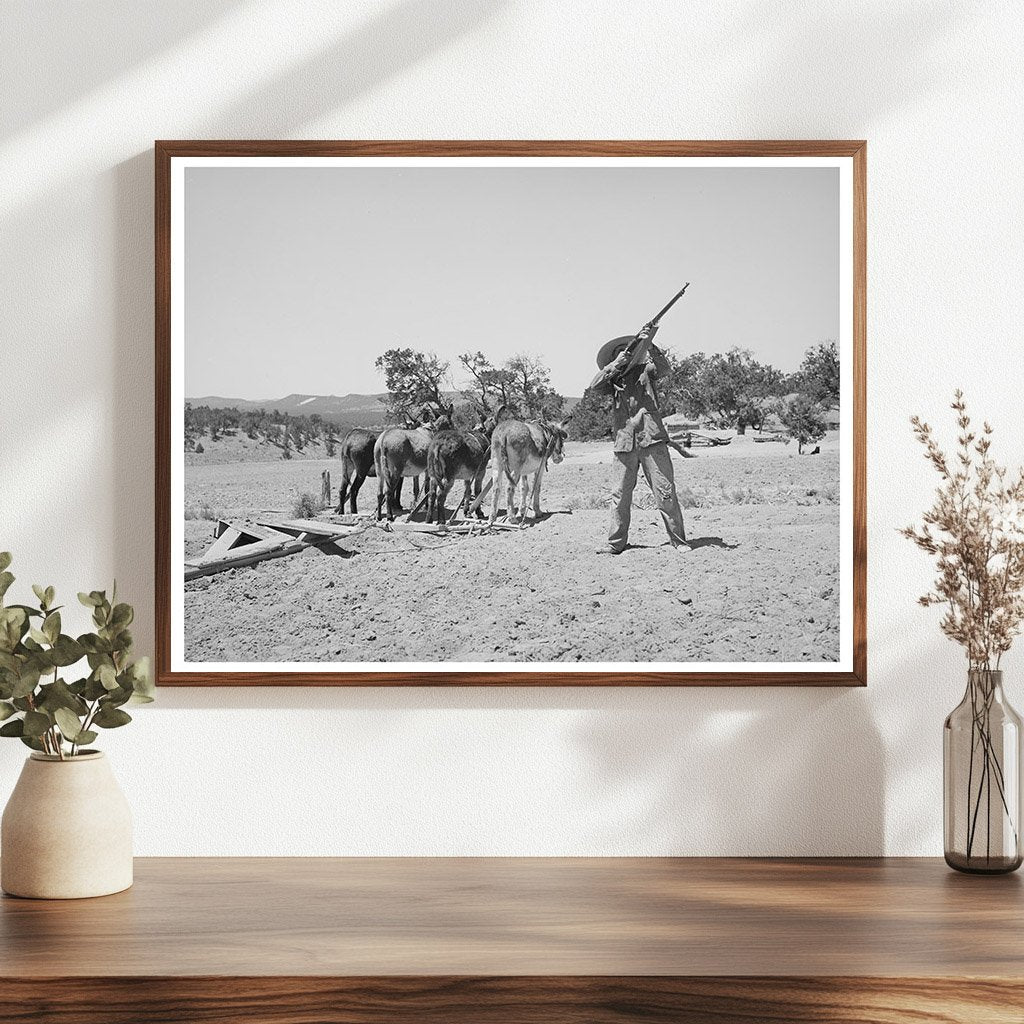 Mr. Leatherman Aiming Rifle at Hawk Pie Town 1940