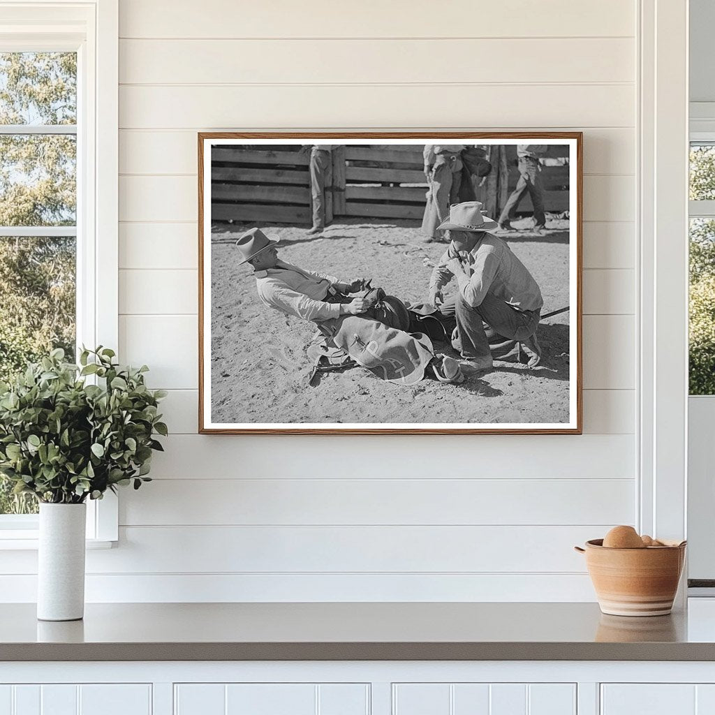 Cowboy Adjusts Stirrup Length for Bronc Busting 1940