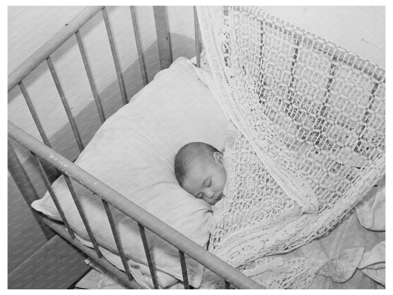 Spanish-American Baby in Crib Taos County July 1940