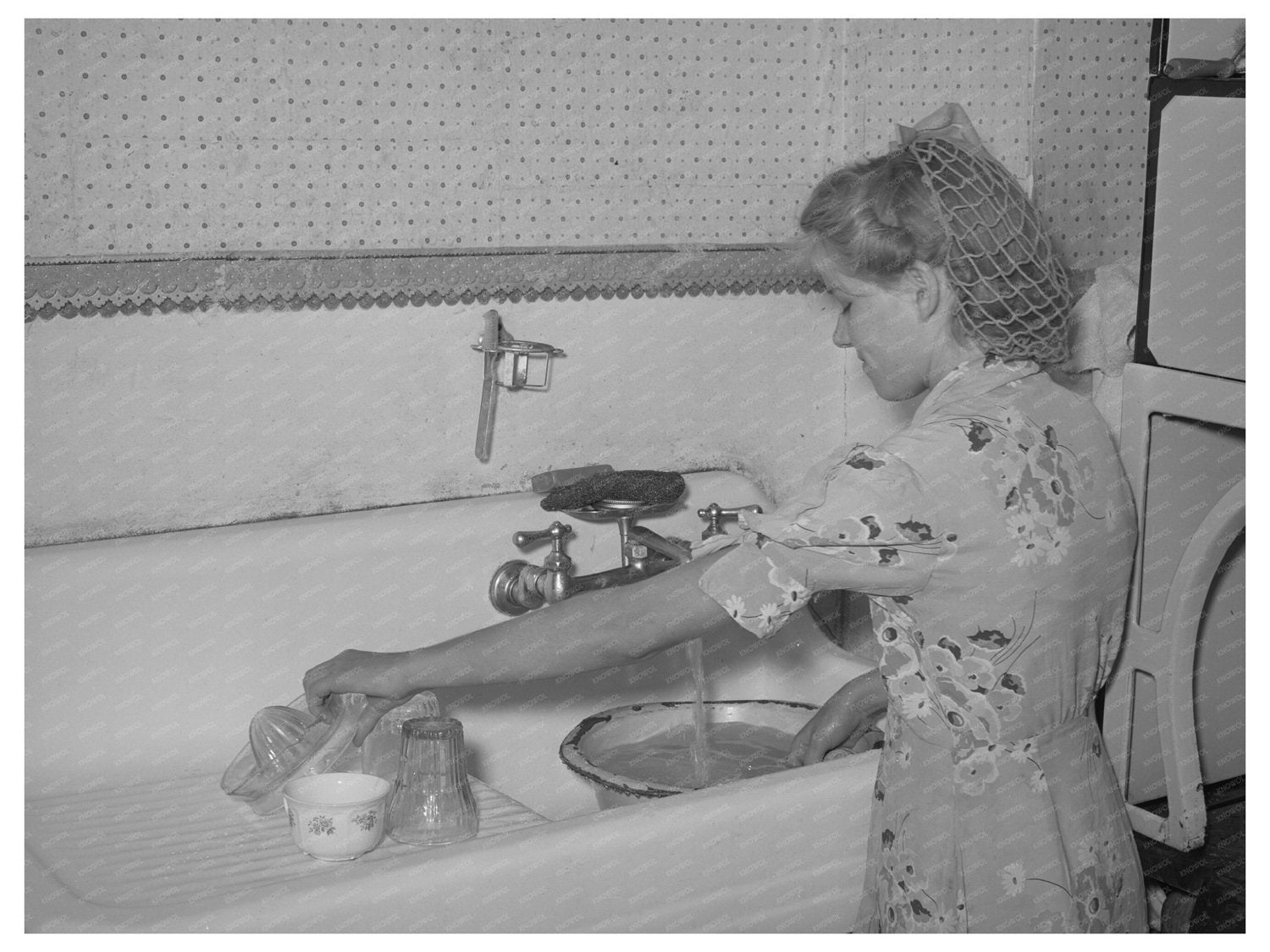 Girl Washing Dishes in Snowville Utah August 1940