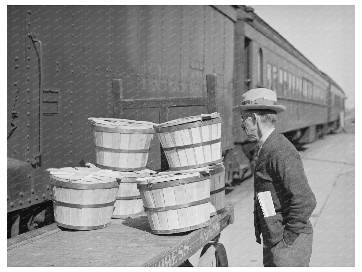 Man Examines Express Packages at Montrose Train Station 1940