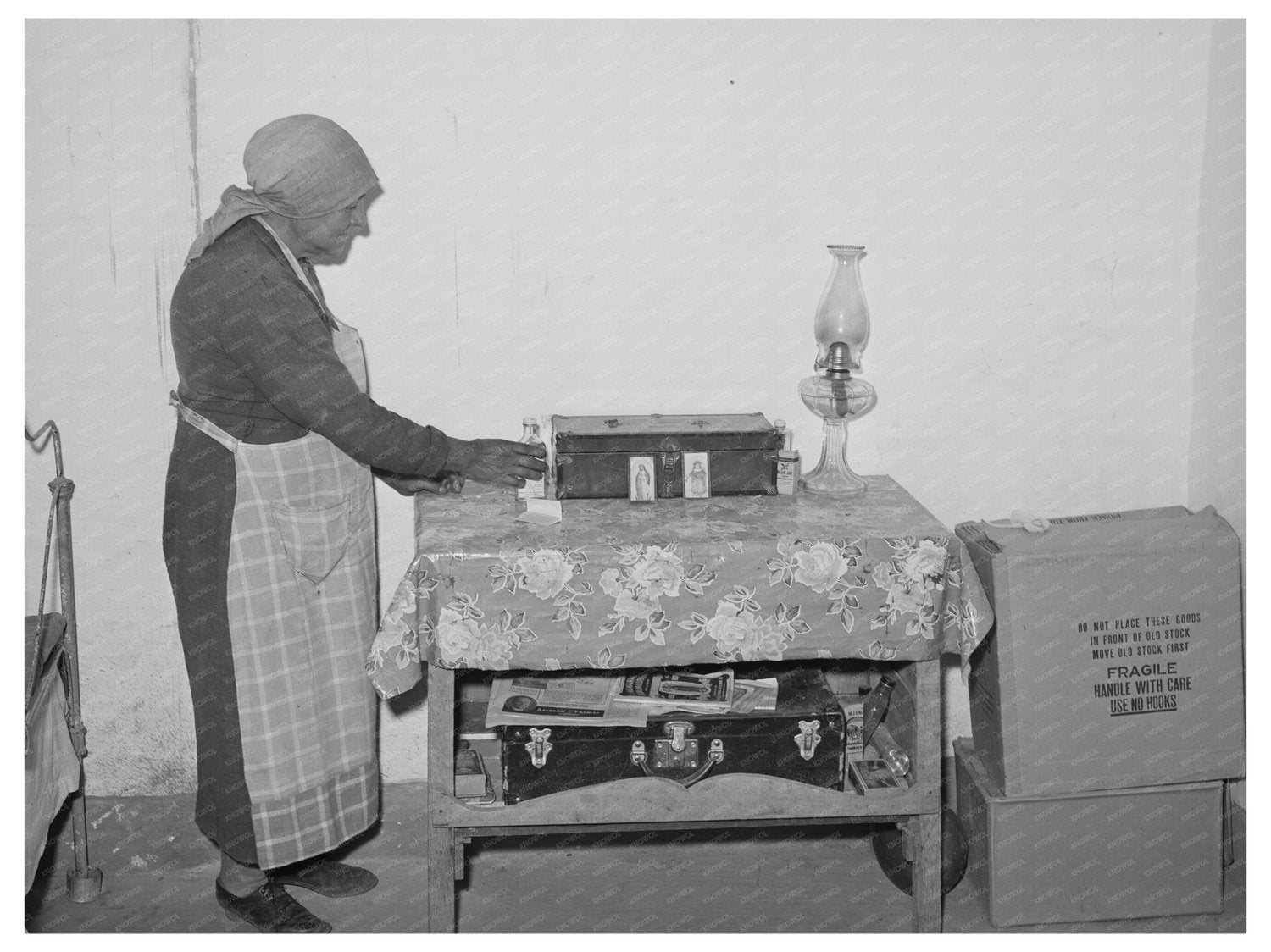 Woman Arranging Items in Concho Arizona 1940