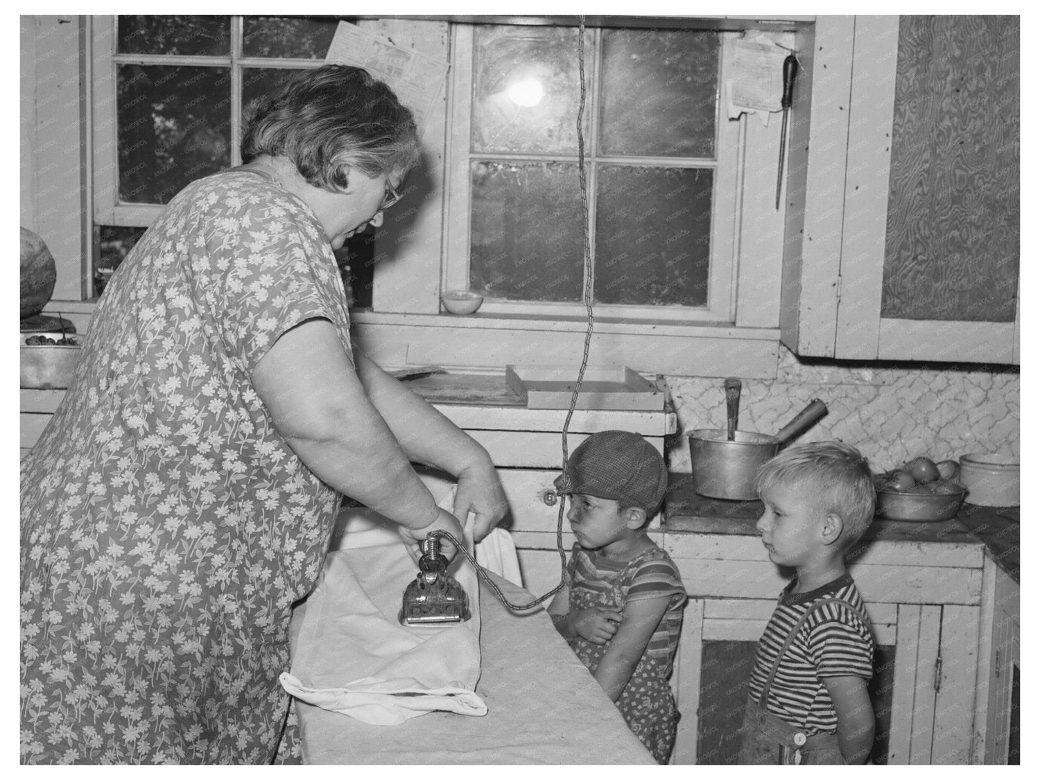 Mrs. J. Webster Ironing with Sons Tehama County 1940
