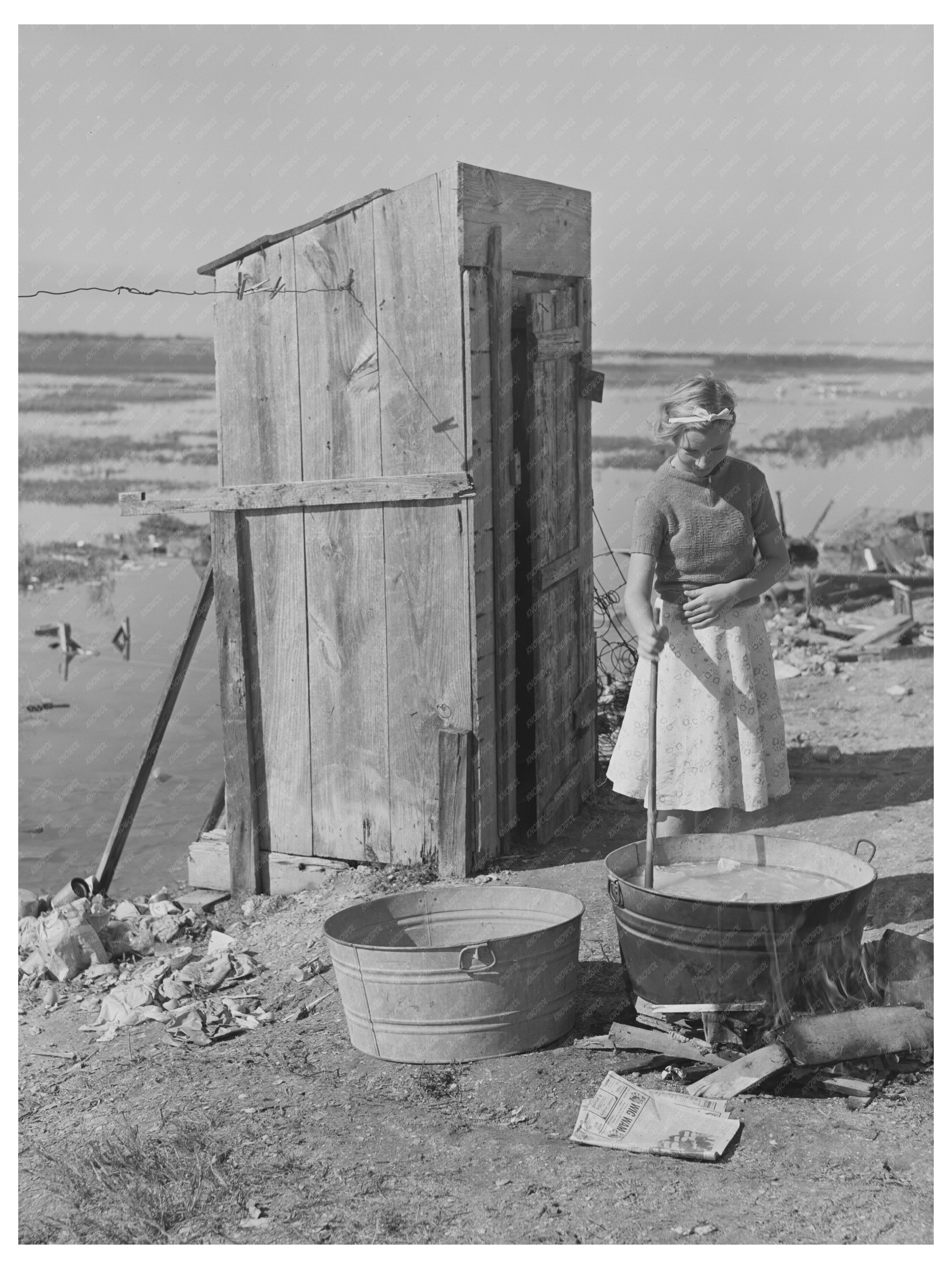 Daughter of Roofer Washing Clothes in Texas 1940