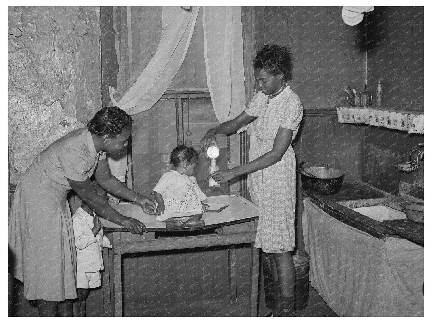Chicago Family Preparing Milk for Baby April 1941