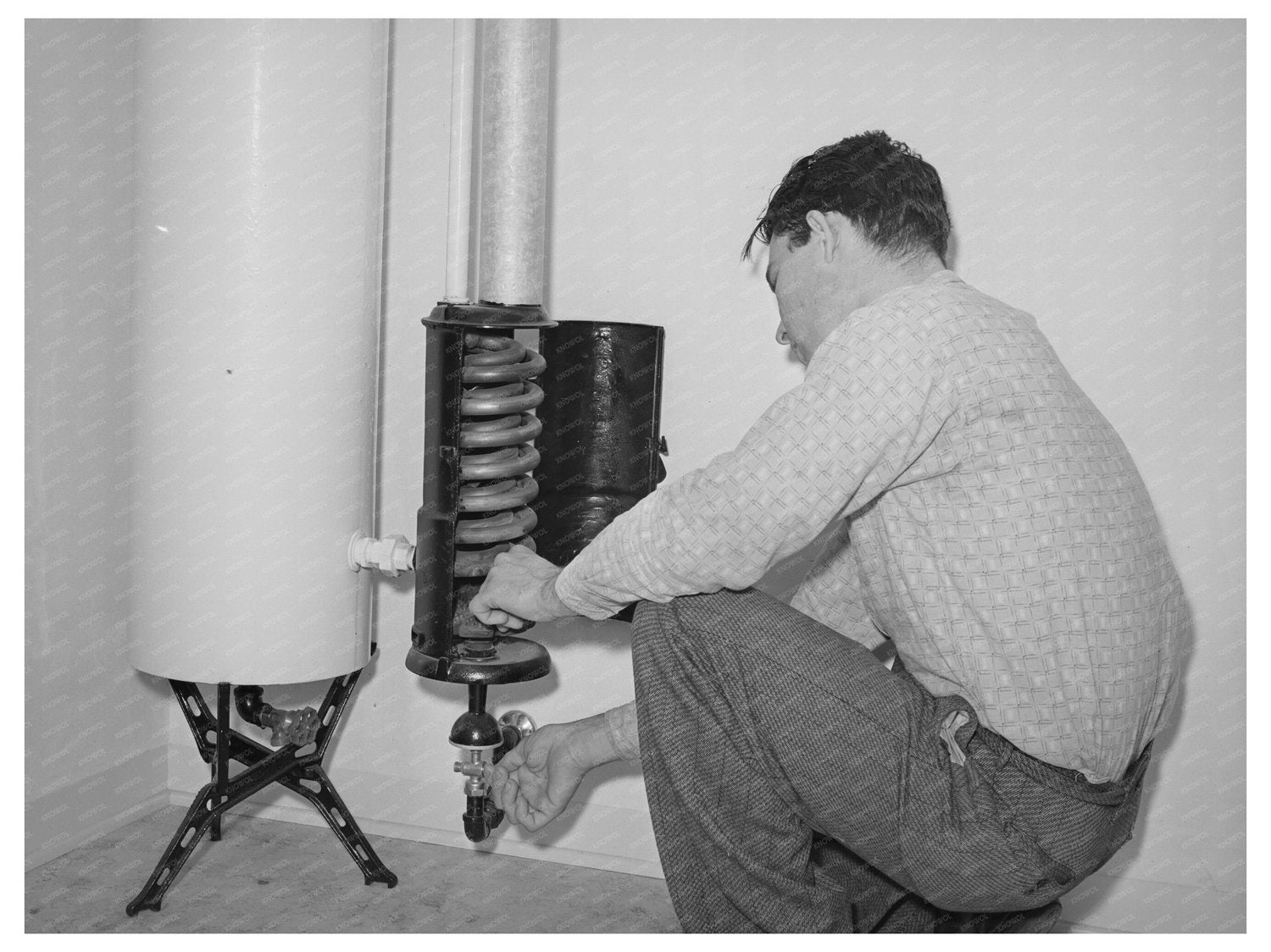 1941 Young Man Lighting Hot Water Heater in San Diego