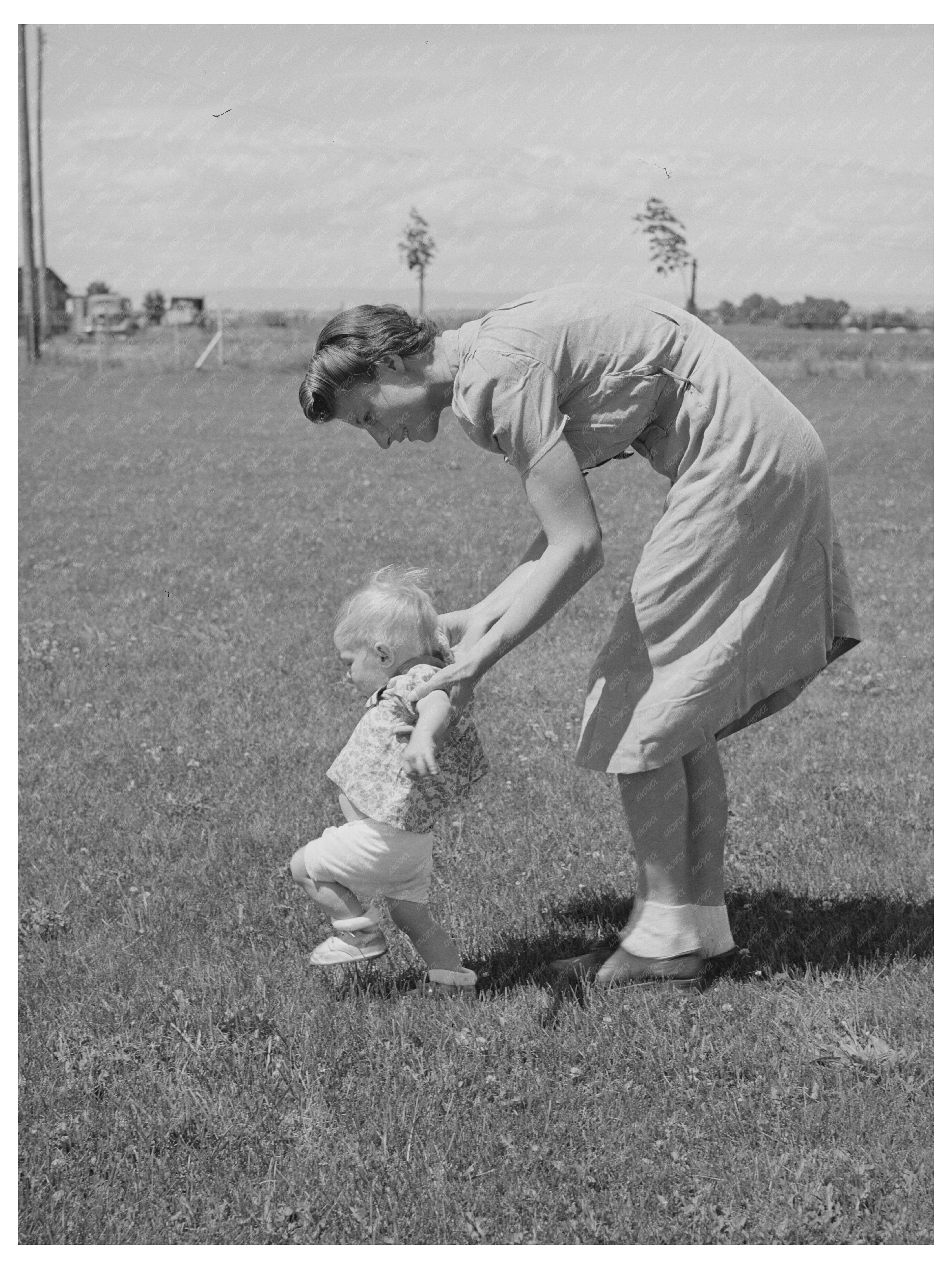 Farm Workers Wife Teaches Daughter to Walk 1941