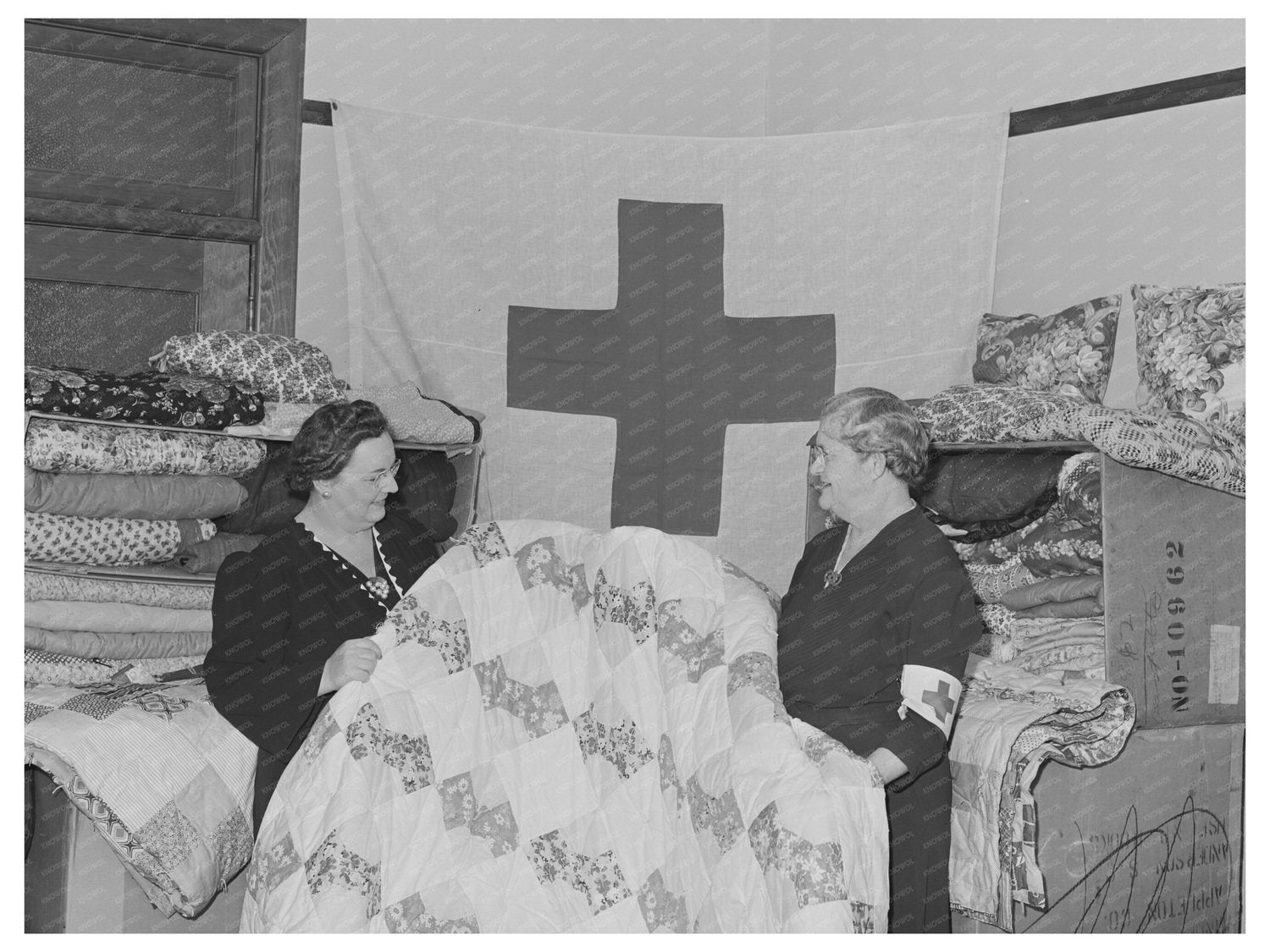 Housewife PTA President with Quilts for Red Cross 1944
