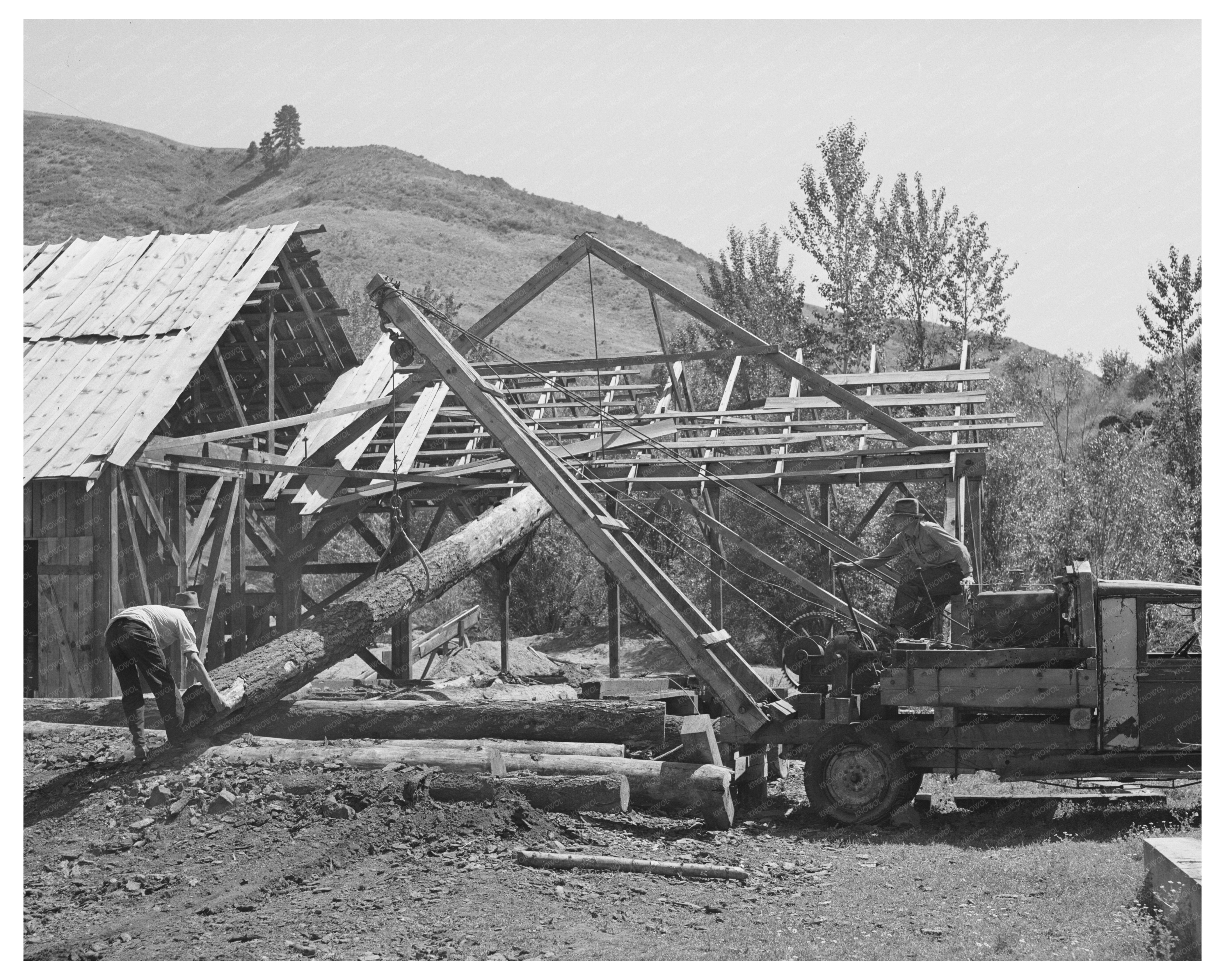 Ola Cooperative Member with Log Gem County Idaho 1942