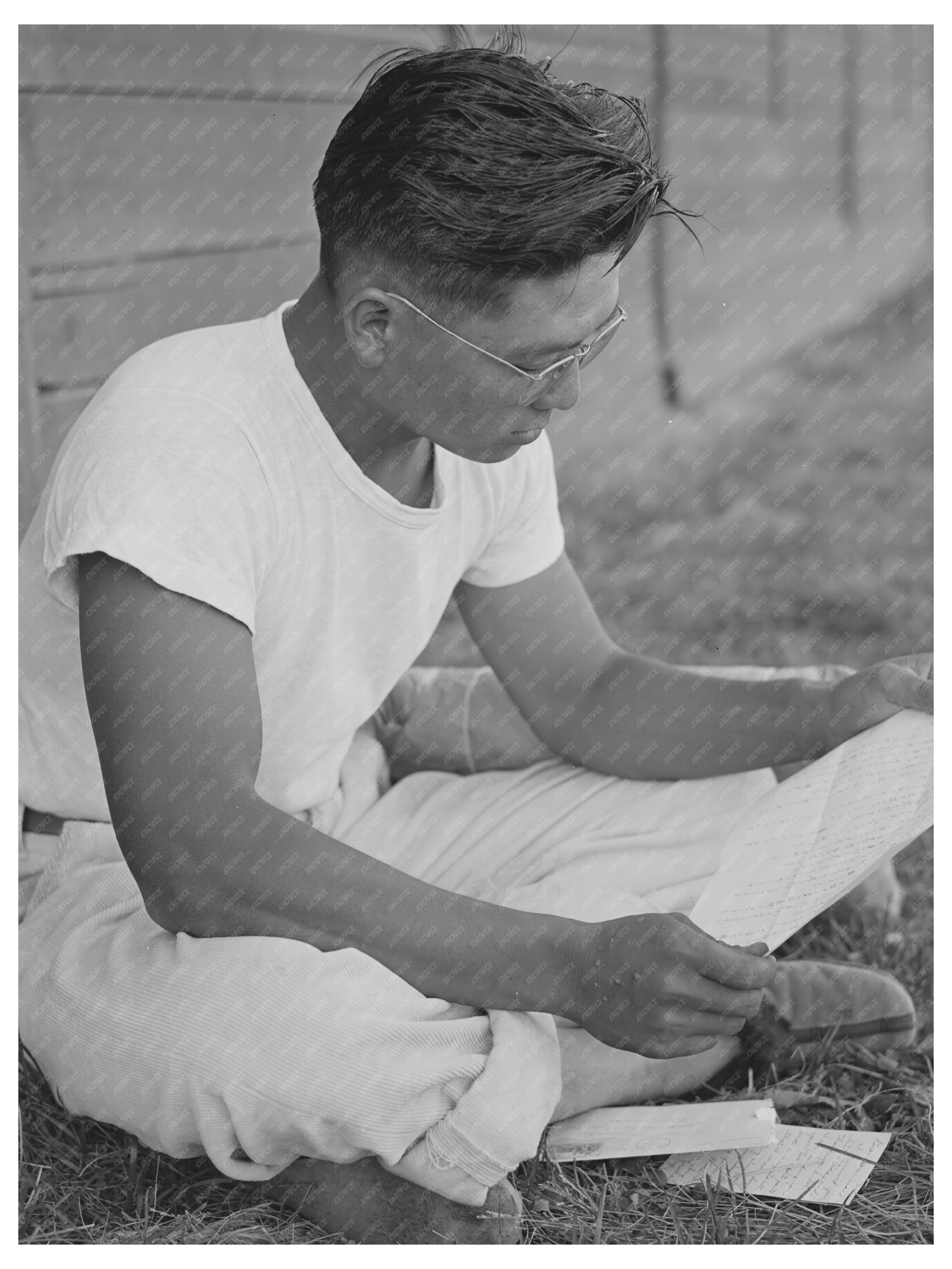 Japanese-American Reading Mail at Idaho Camp July 1942