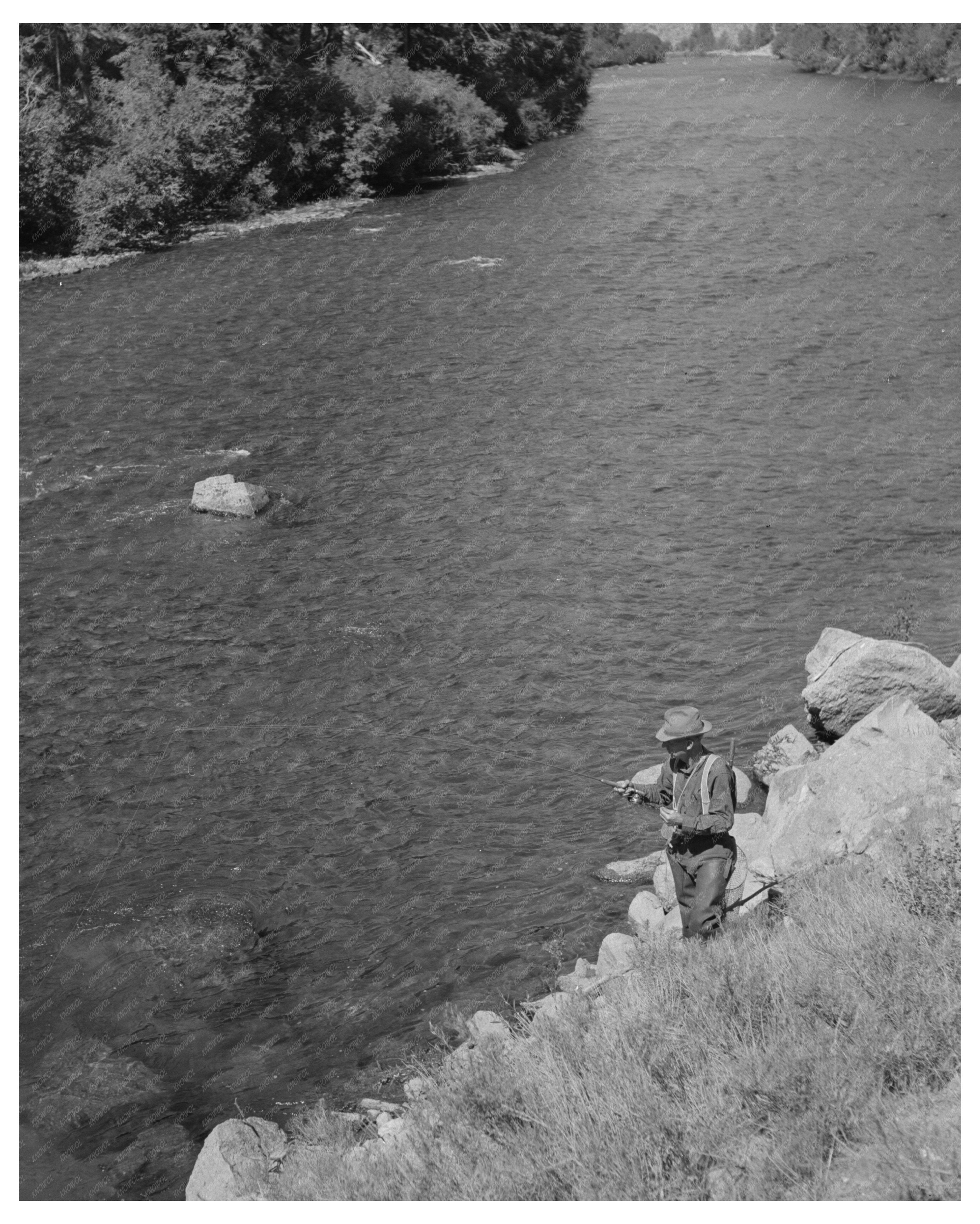 Fisherman and Dog at Salmon River Idaho August 1942
