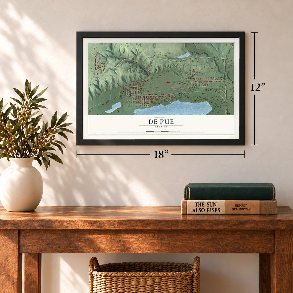 De Pue, Illinois map, 12 x 18 inch print in a black frame in an entryway