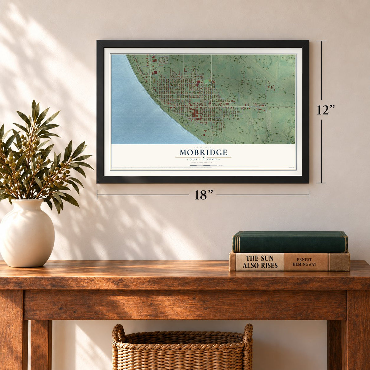 Mobridge, South Dakota map, 12 x 18 inch print in a black frame in an entryway