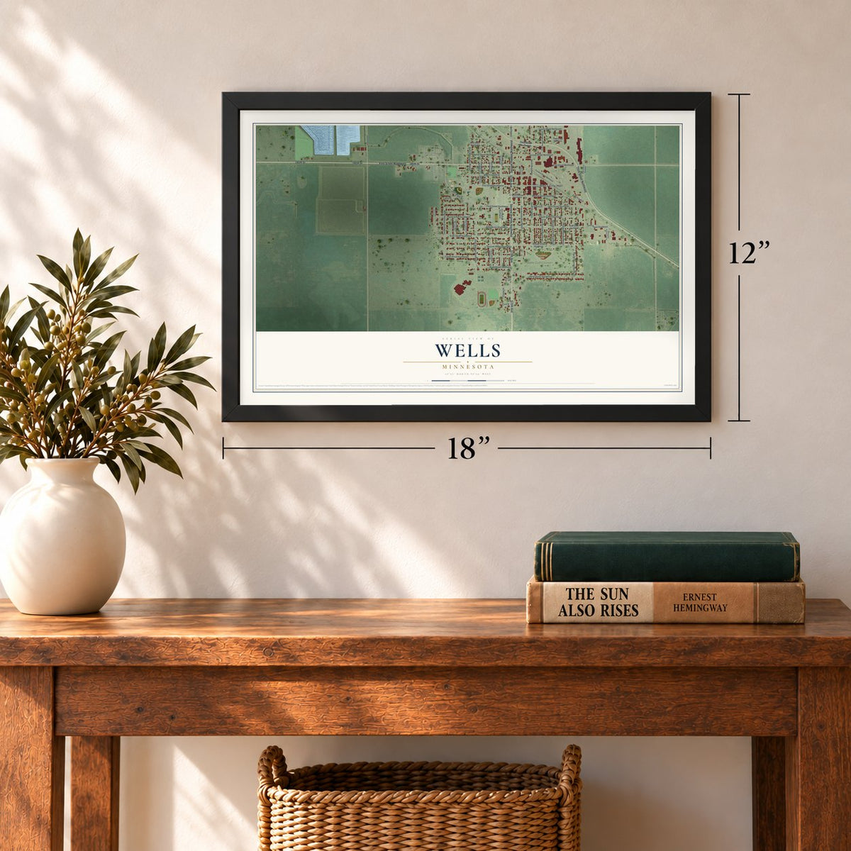 Wells, Minnesota map, 12 x 18 inch print in a black frame in an entryway