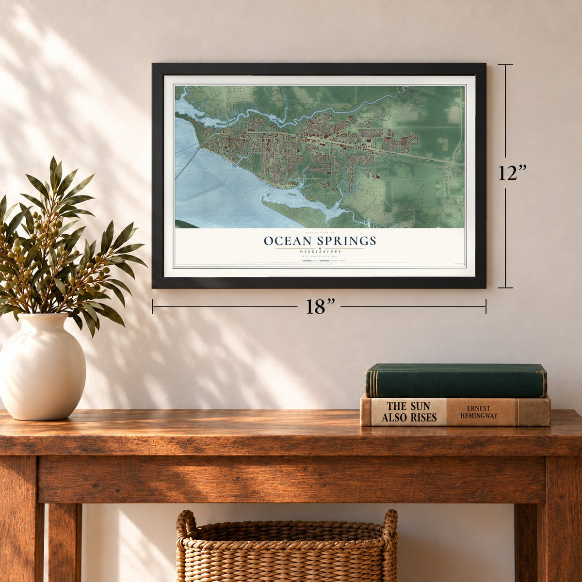 Ocean Springs, Mississippi map, 12 x 18 inch print in a black frame in an entryway