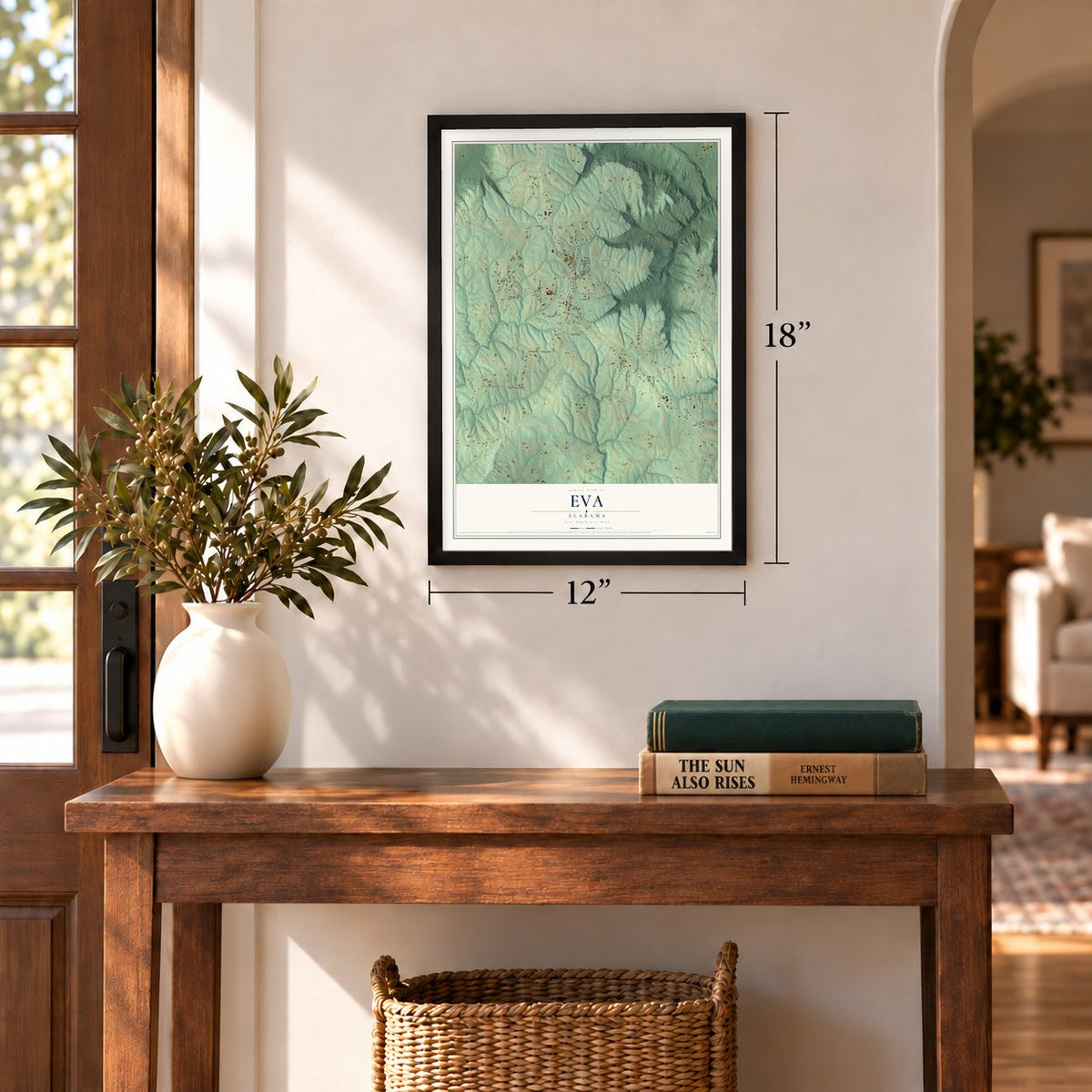 Eva, Alabama map, 12 x 18 inch print in a black frame in an entryway