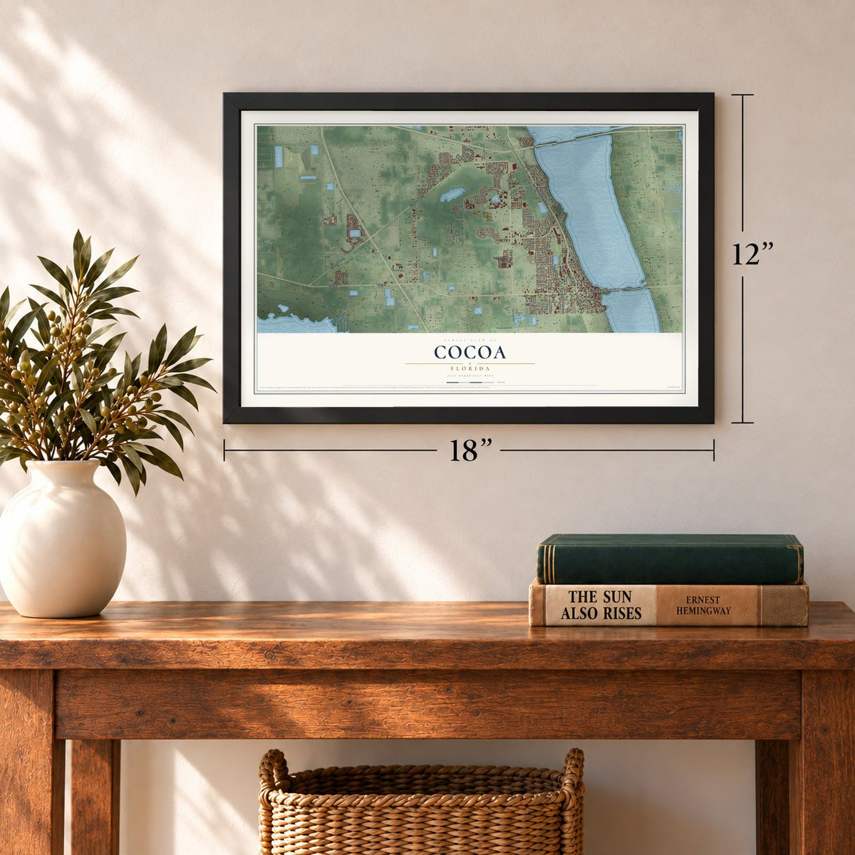 Cocoa, Florida map, 12 x 18 inch print in a black frame in an entryway