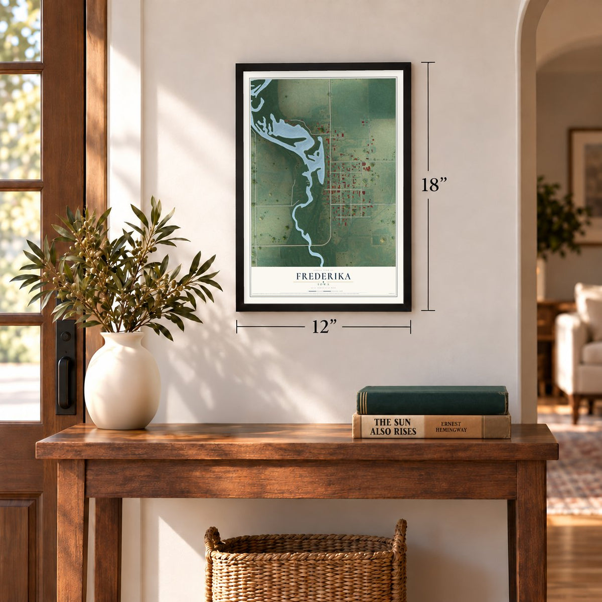 Frederika, Iowa map, 12 x 18 inch print in a black frame in an entryway