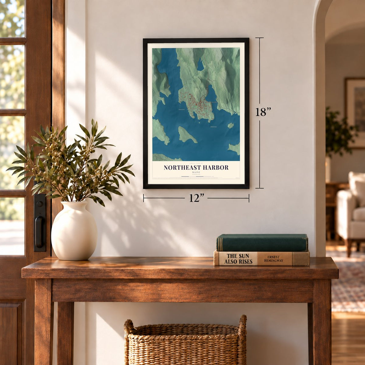Northeast Harbor, Maine map, 12 x 18 inch print in a black frame in an entryway