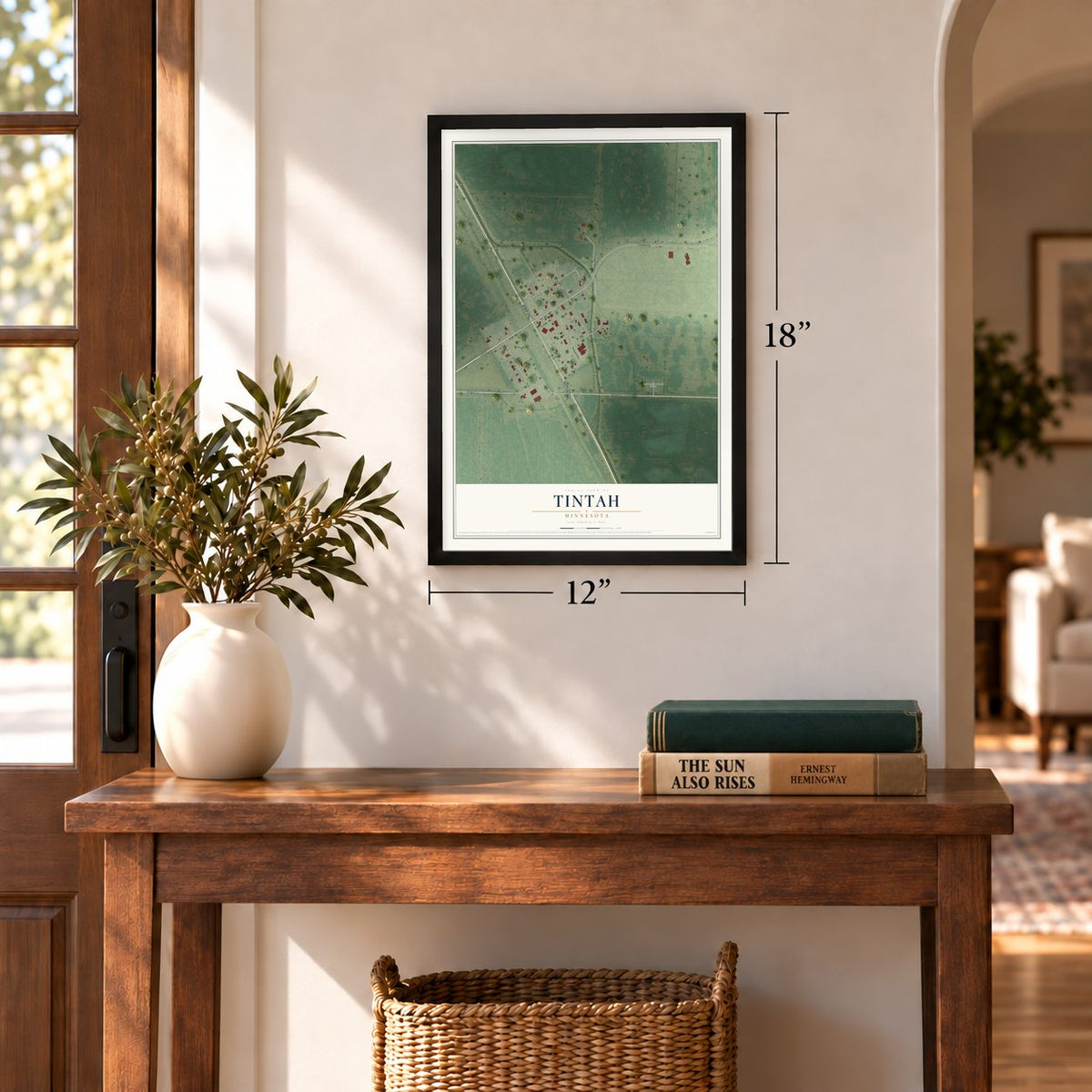 Tintah, Minnesota map, 12 x 18 inch print in a black frame in an entryway