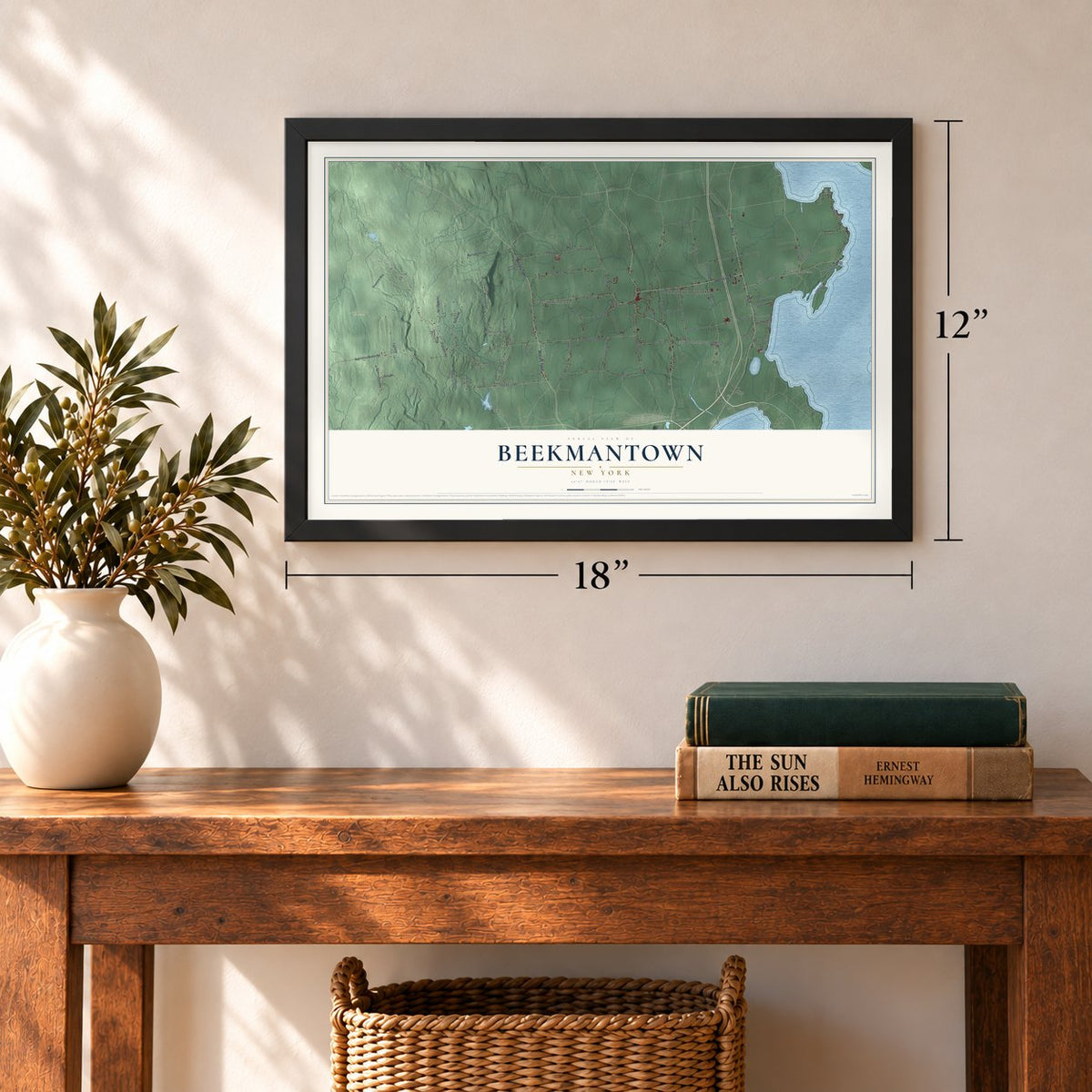 Beekmantown, New York map, 12 x 18 inch print in a black frame in an entryway