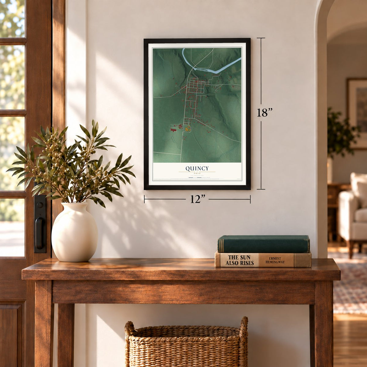Quincy, Ohio map, 12 x 18 inch print in a black frame in an entryway