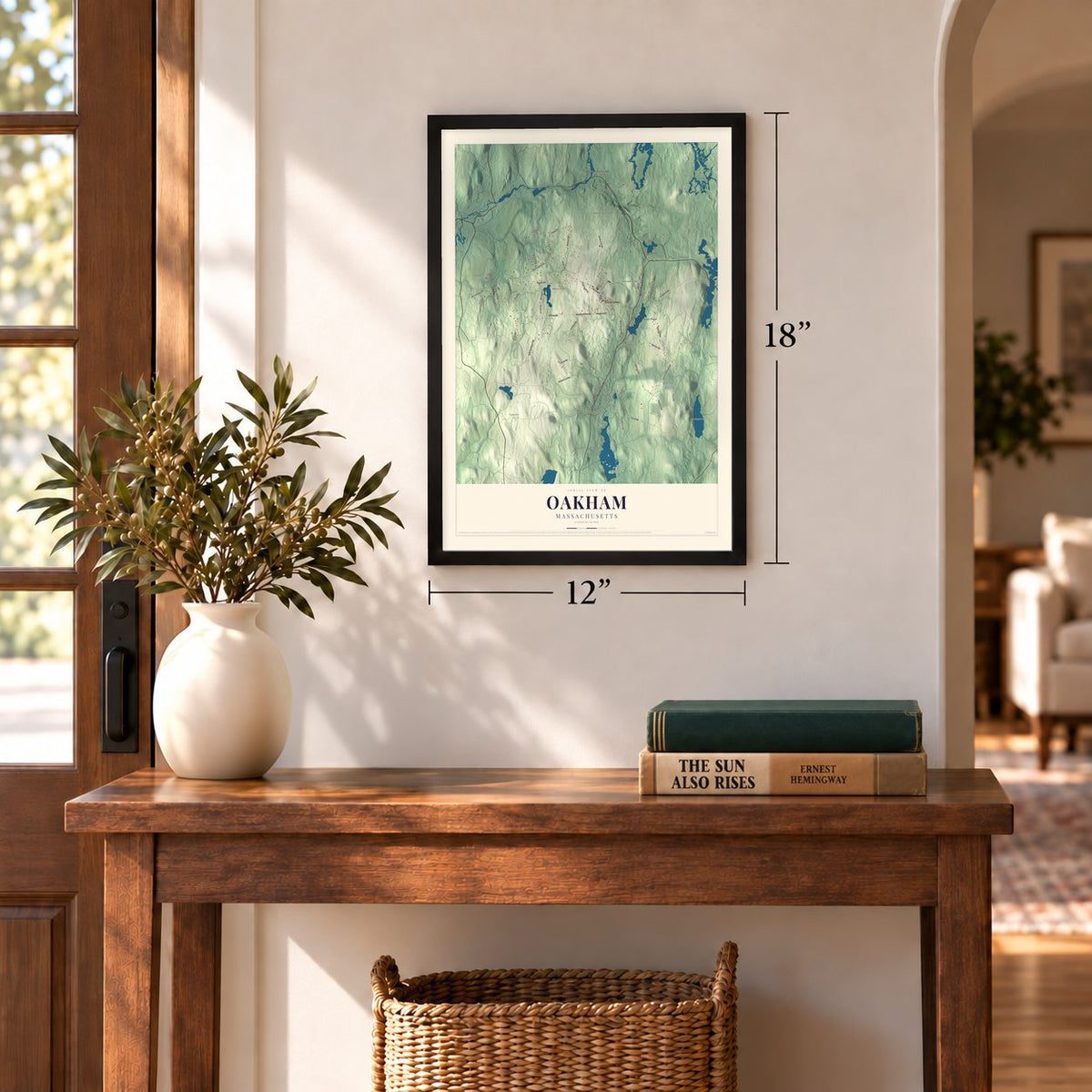 Oakham, Massachusetts map, 12 x 18 inch print in a black frame in an entryway
