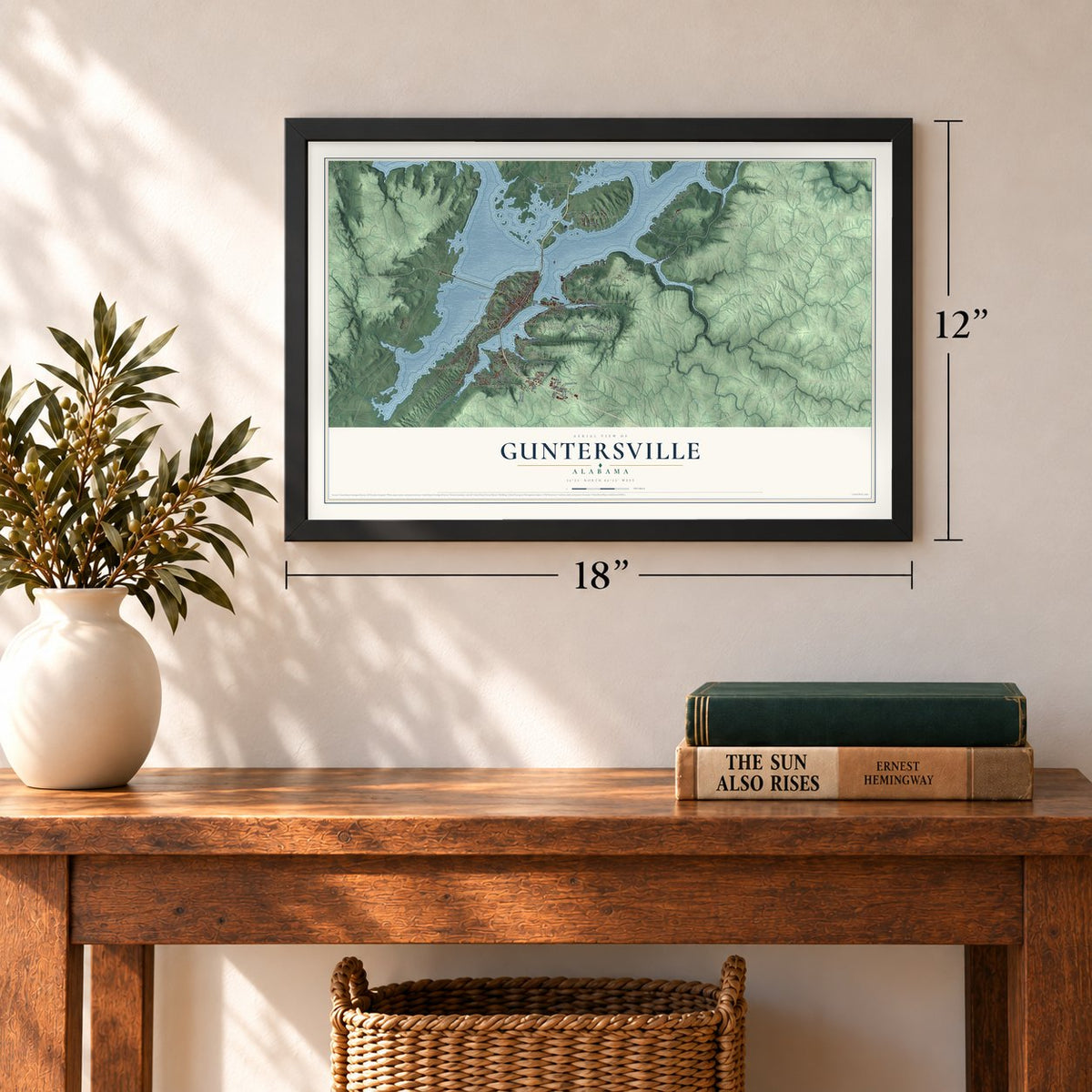 Guntersville, Alabama map, 12 x 18 inch print in a black frame in an entryway