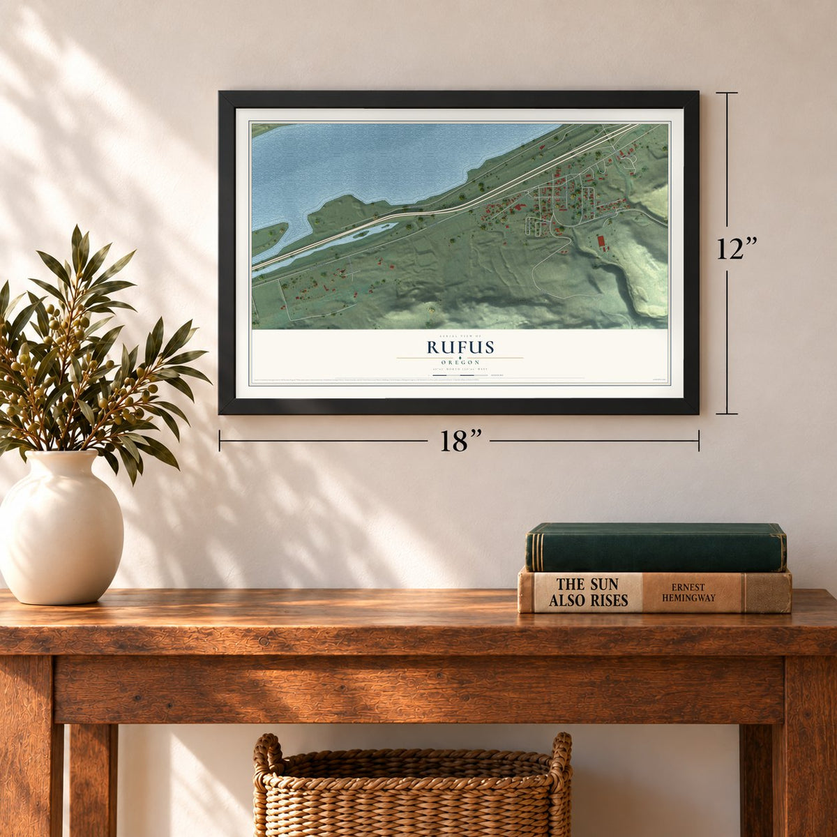 Rufus, Oregon map, 12 x 18 inch print in a black frame in an entryway