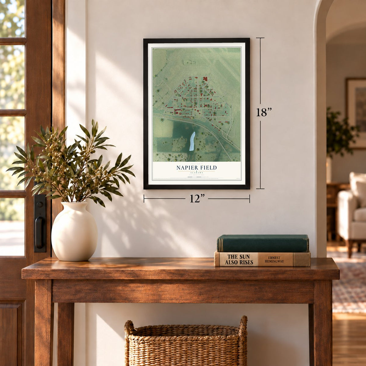 Napier Field, Alabama map, 12 x 18 inch print in a black frame in an entryway