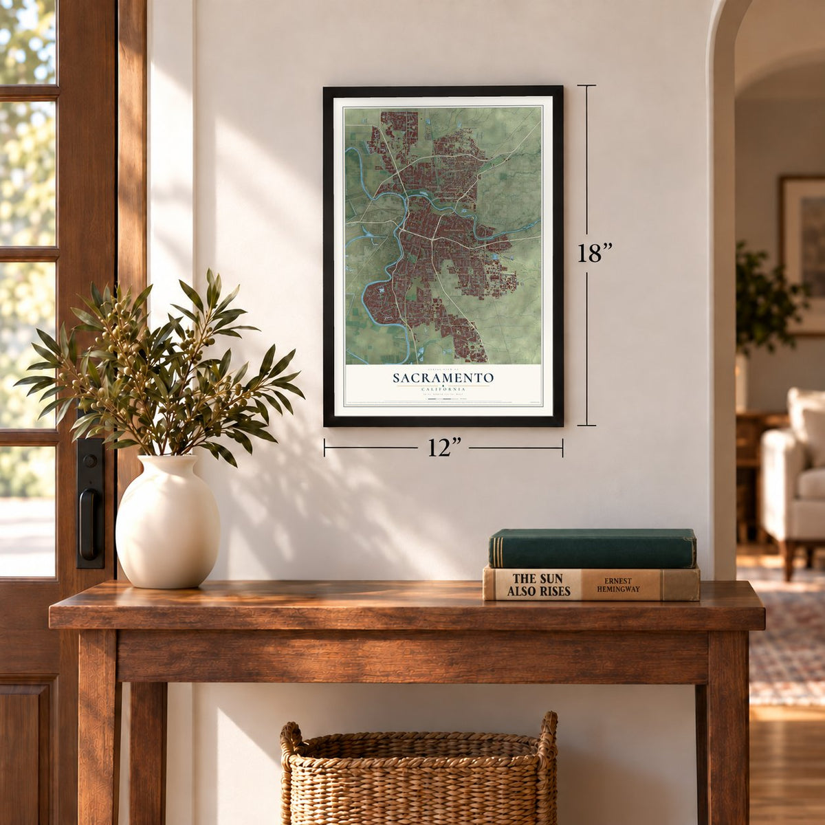 Sacramento, California map, 12 x 18 inch print in a black frame in an entryway
