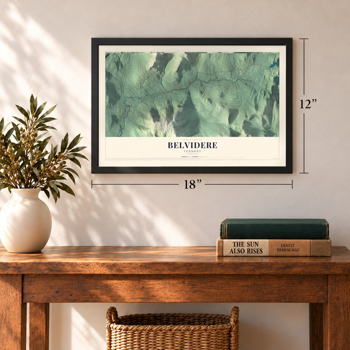 Belvidere, Vermont map, 12 x 18 inch print in a black frame in an entryway