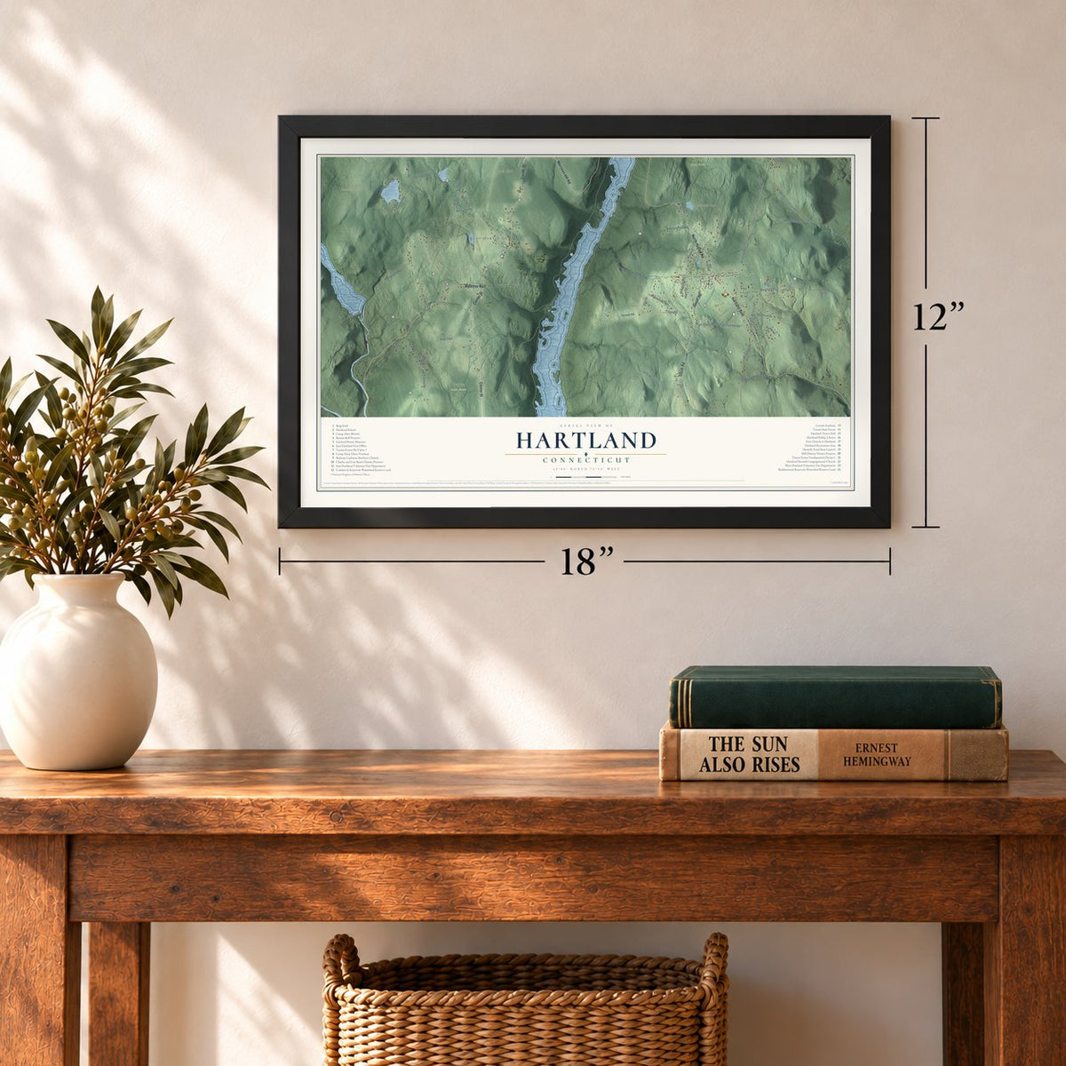 Hartland, Connecticut map, 12 x 18 inch print in a black frame in an entryway