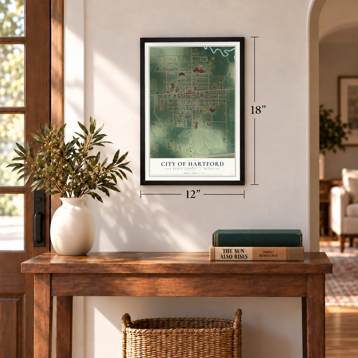 Hartford, Michigan map, 12 x 18 inch print in a black frame in an entryway
