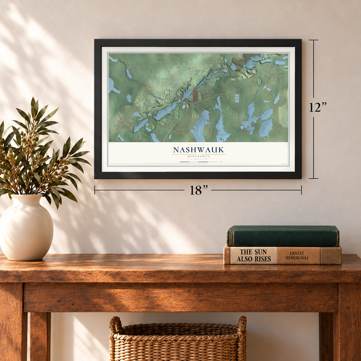 Nashwauk, Minnesota map, 12 x 18 inch print in a black frame in an entryway