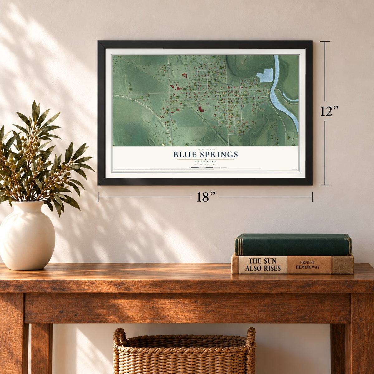 Blue Springs, Nebraska map, 12 x 18 inch print in a black frame in an entryway