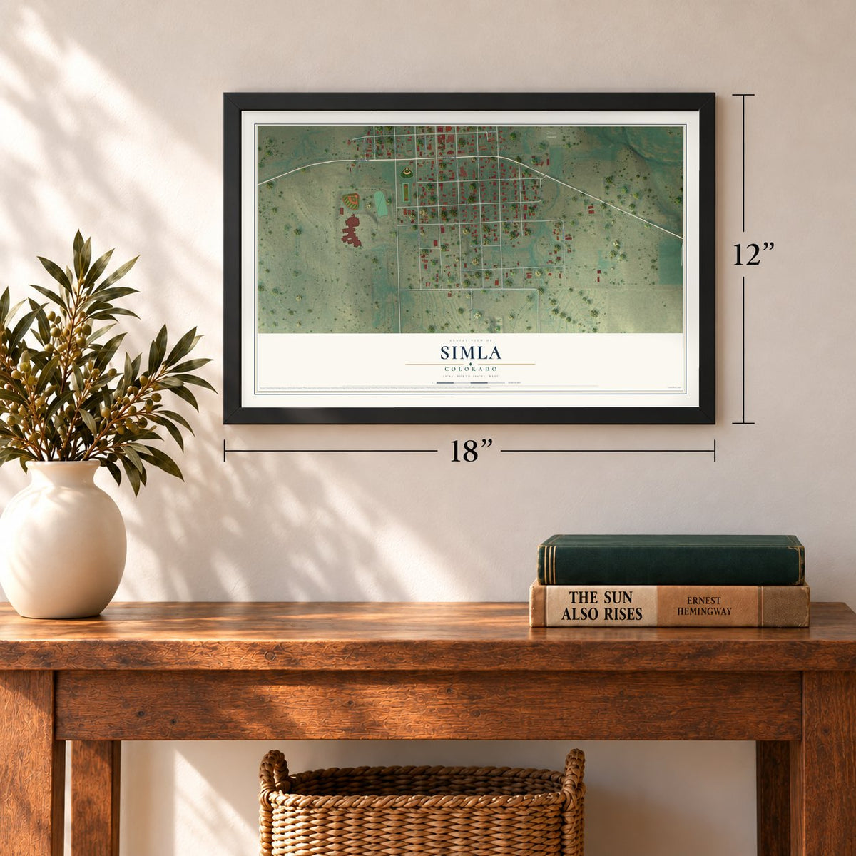 Simla, Colorado map, 12 x 18 inch print in a black frame in an entryway