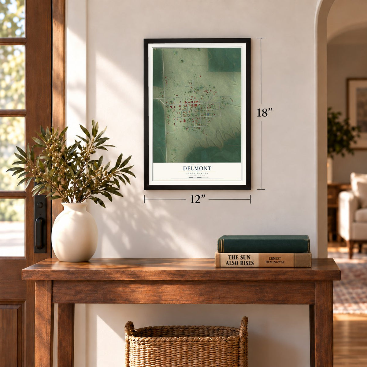 Delmont, South Dakota map, 12 x 18 inch print in a black frame in an entryway