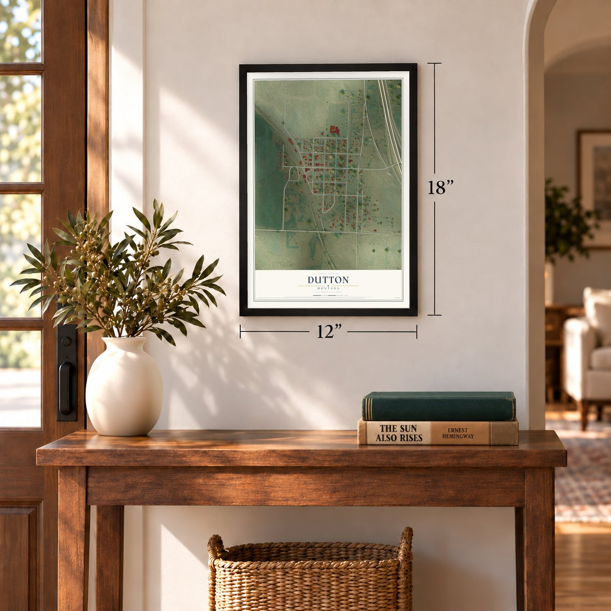 Dutton, Montana map, 12 x 18 inch print in a black frame in an entryway