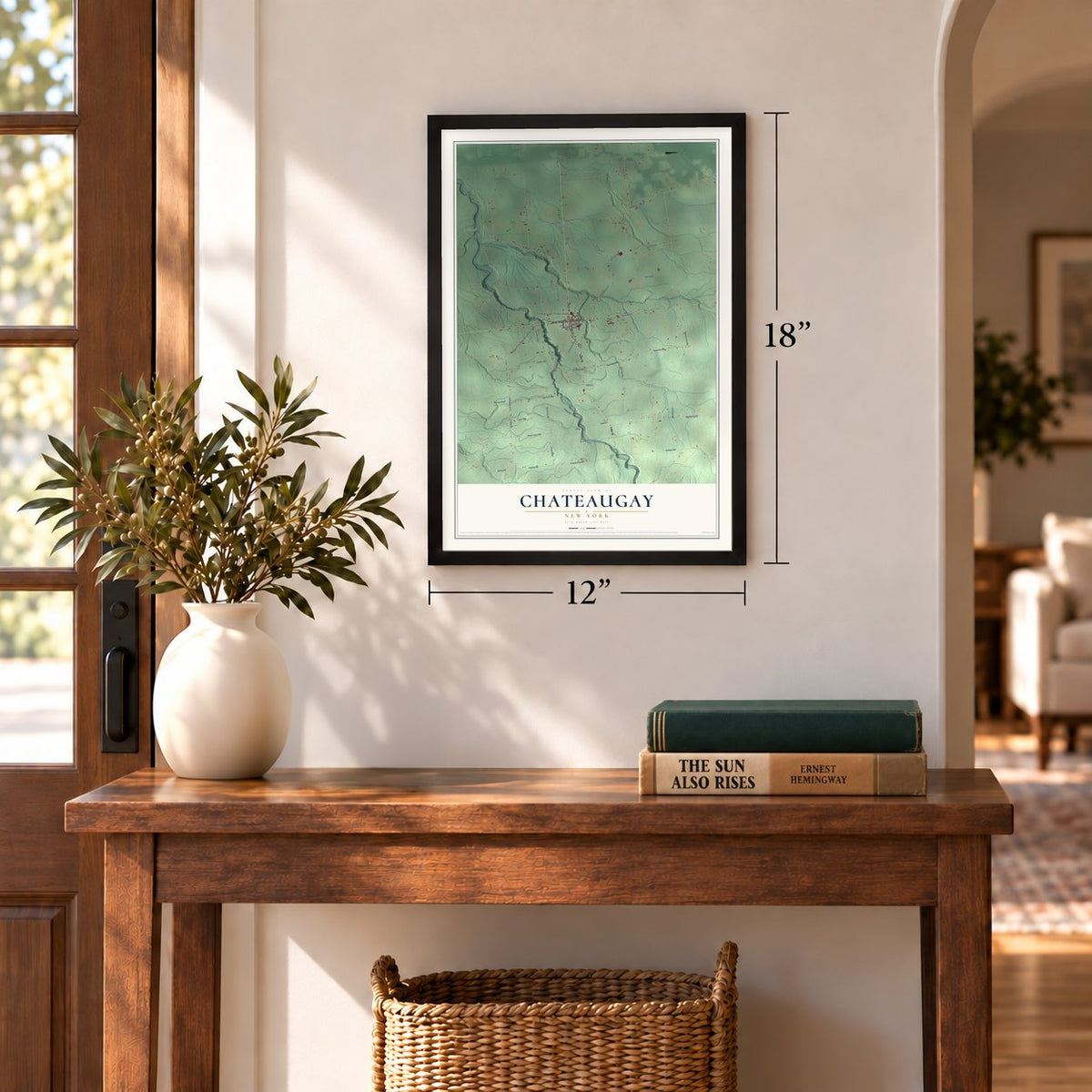 Chateaugay, New York map, 12 x 18 inch print in a black frame in an entryway