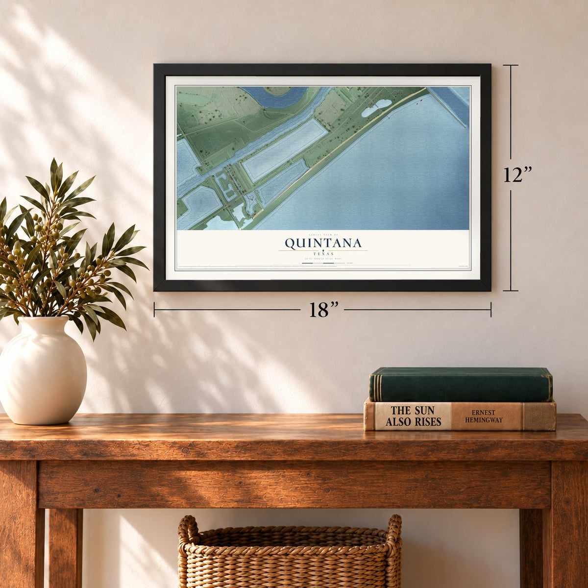 Quintana, Texas map, 12 x 18 inch print in a black frame in an entryway