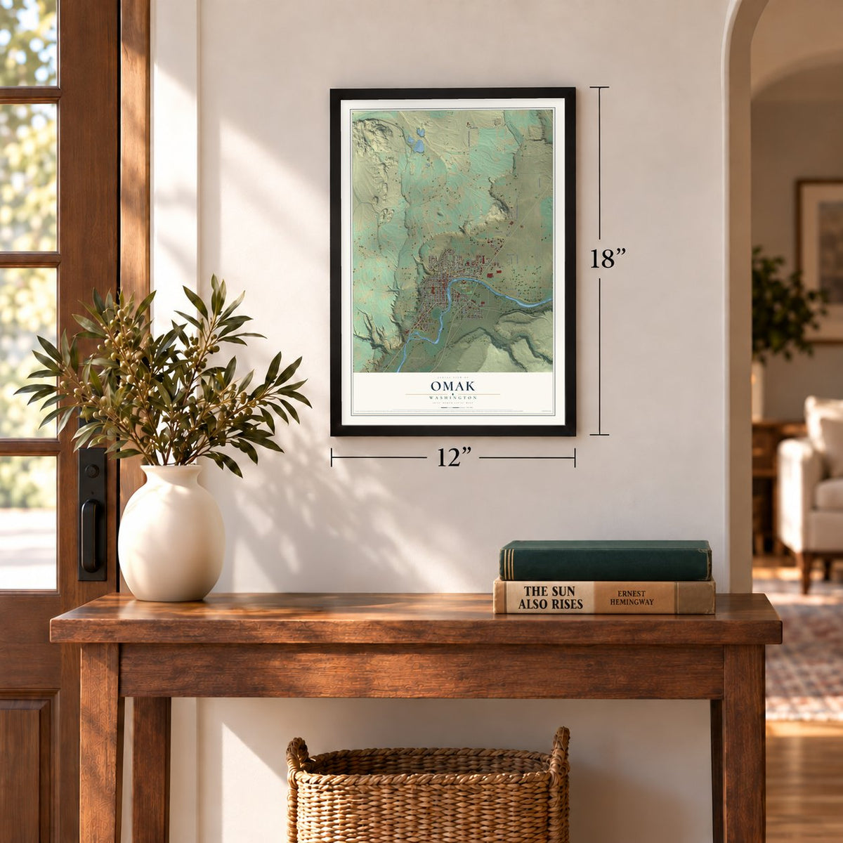 Omak, Washington map, 12 x 18 inch print in a black frame in an entryway