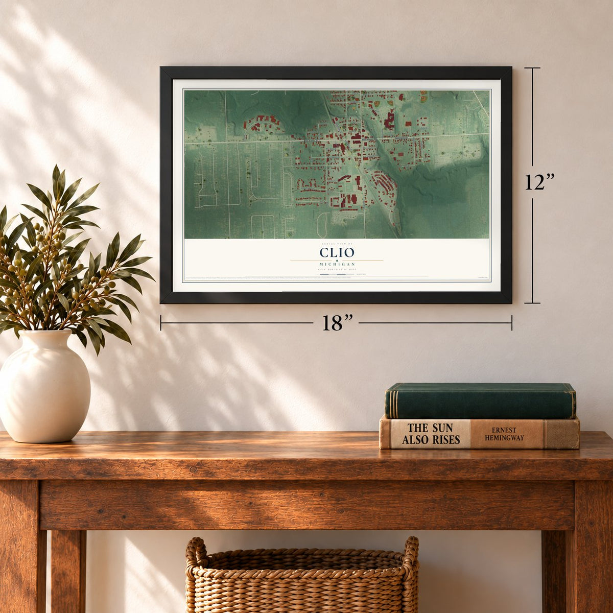Clio, Michigan map, 12 x 18 inch print in a black frame in an entryway
