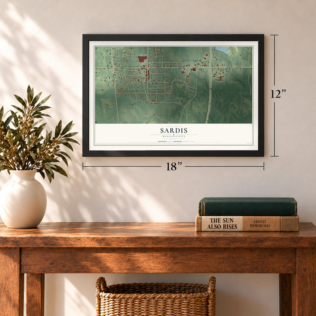 Sardis, Mississippi map, 12 x 18 inch print in a black frame in an entryway