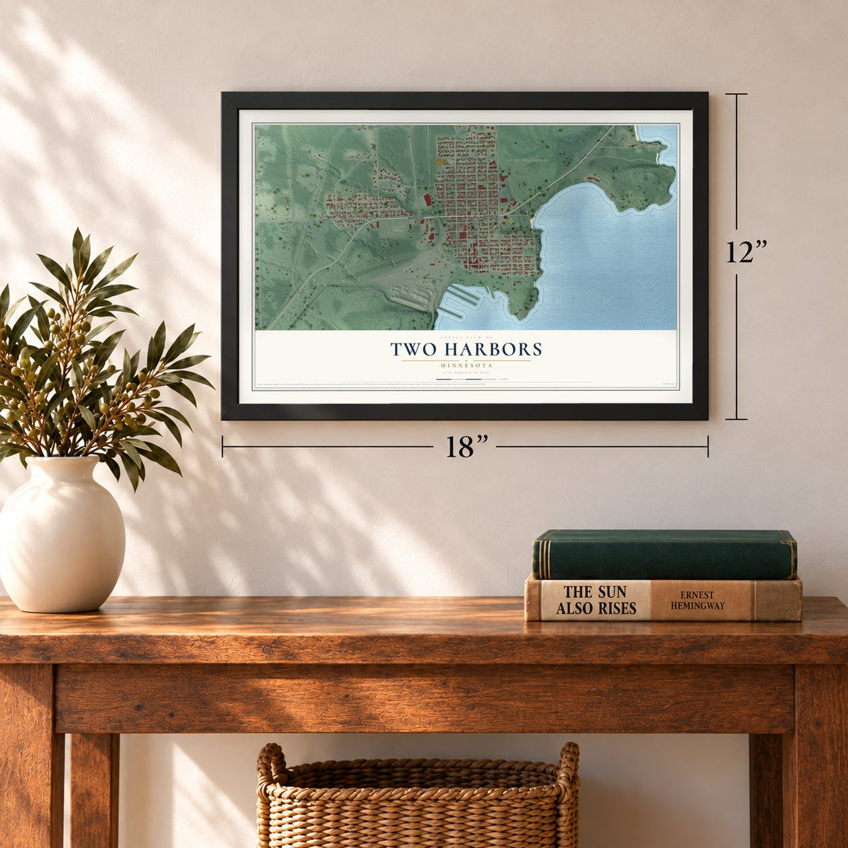 Two Harbors, Minnesota map, 12 x 18 inch print in a black frame in an entryway