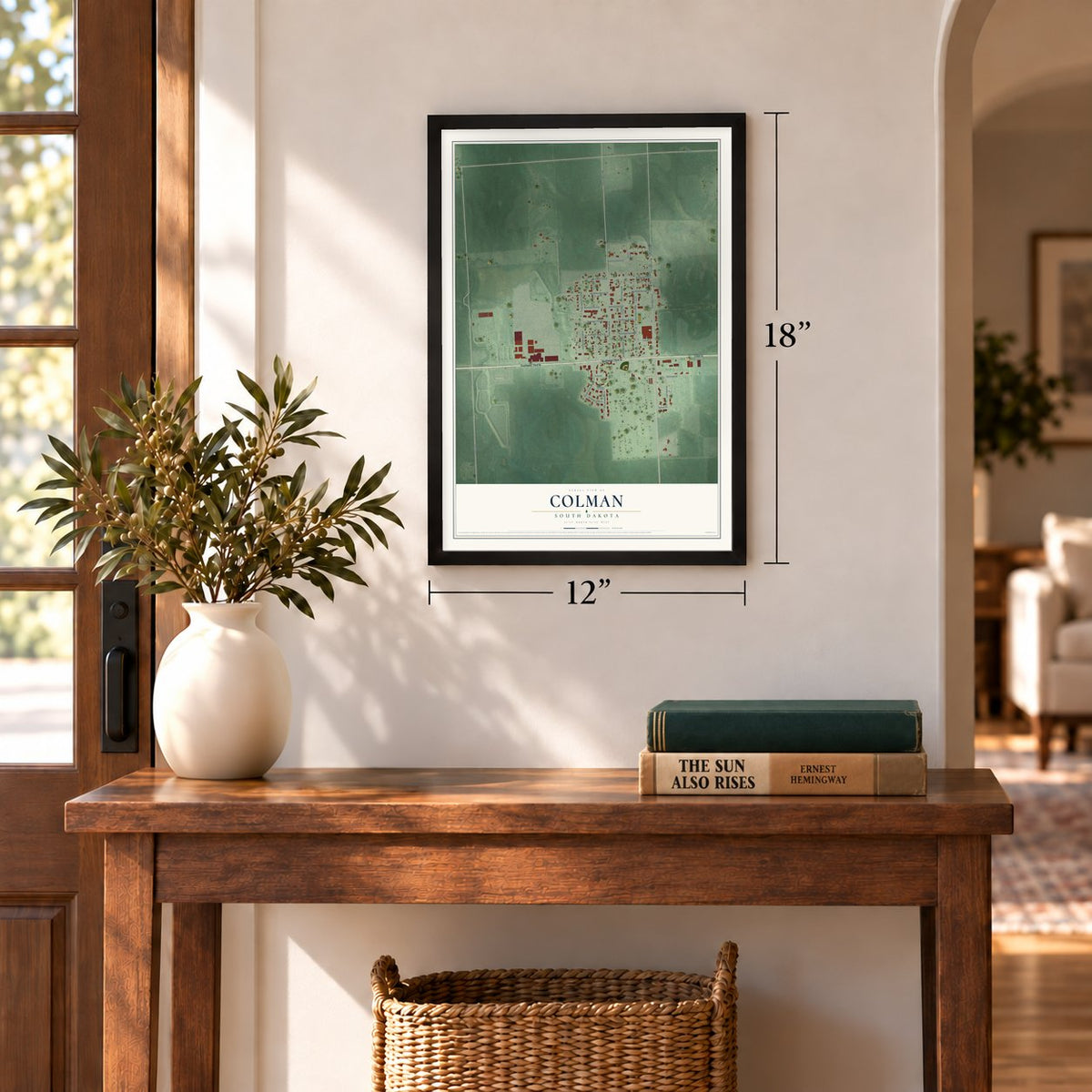 Colman, South Dakota map, 12 x 18 inch print in a black frame in an entryway