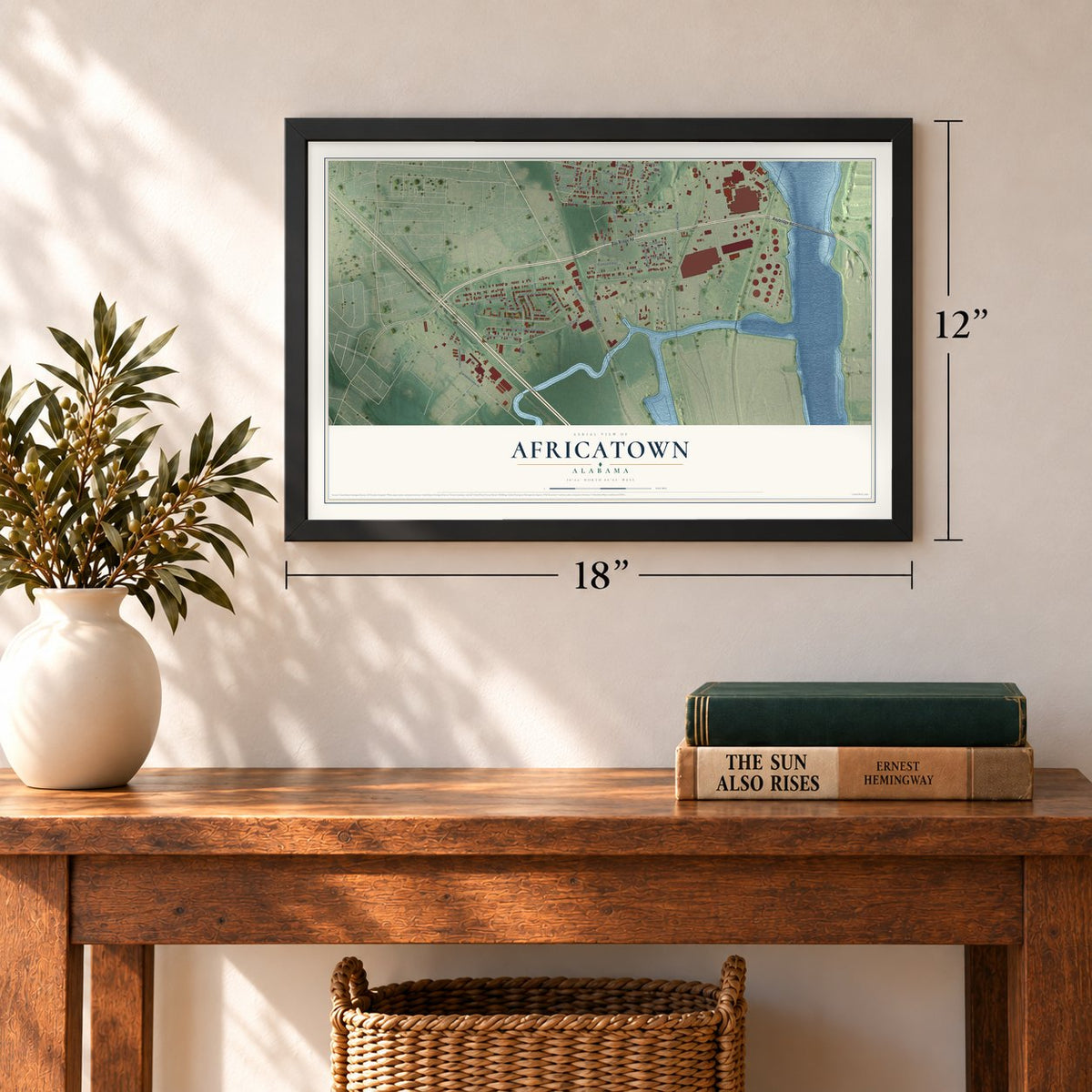Africatown, Alabama map, 12 x 18 inch print in a black frame in an entryway